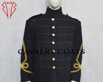 May include: A black military-style jacket with gold trim and buttons. The jacket has a stand-up collar and a single-breasted closure. The sleeves have gold braid detailing. "CAVALRY COATS" is printed on the front of the jacket.