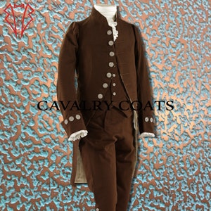 May include: A brown, long-sleeved coat with a high collar and silver buttons. The coat has a long tail and is worn over a matching brown waistcoat and trousers. The text "CAVALRY COATS" is visible in the image.