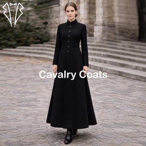 May include: A long, black coat with a high collar and button-down front. The coat has a flared skirt and is worn by a person. The text "Cavalry Coats" is displayed on the coat.
