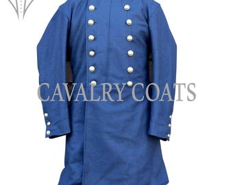 May include: A dark blue long coat with a stand-up collar and a row of silver buttons down the front. The coat has a long, flowing style and is made of a thick, durable fabric.  "CAVALRY COATS" is printed in white on the front of the coat.