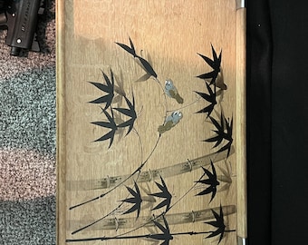 May include: A wooden serving tray with a silver metal rim. The tray features a black and white design of bamboo stalks and birds.