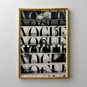 May include: A framed wall art print featuring a vertical collage of seven black and white Vogue Italia magazine covers. Each segment displays the bold, iconic Vogue logo and the word Italia, layered with various photographic details and text.