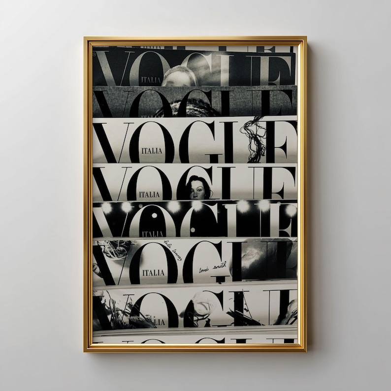 May include: A framed wall art print featuring a vertical collage of seven black and white Vogue Italia magazine covers. Each segment displays the bold, iconic Vogue logo and the word Italia, layered with various photographic details and text.
