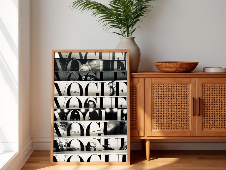 May include: A rectangular framed wall art piece featuring a collage of black and white Vogue Italia magazine covers stacked horizontally. The print displays the bold, iconic Vogue logo repeated across multiple segments, showcasing various photographic details.
