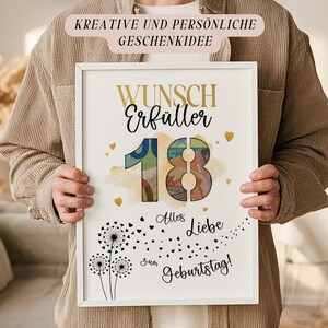 May include: A framed print with the text "Wunsch Erf&uuml;ller 18 Alles Liebe zum Geburtstag!" in gold and black. The number 18 is filled with a colourful design. The print also features dandelion illustrations and heart accents.