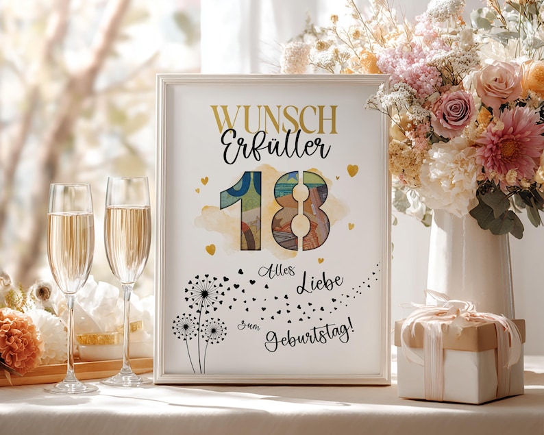 May include: A framed print with the words "Wunsch Erf&uuml;ller 18 Alles Liebe zum Geburtstag!" in gold and black. The number 18 is colourful. Two champagne flutes are in the foreground, and a bouquet of flowers is in the background.