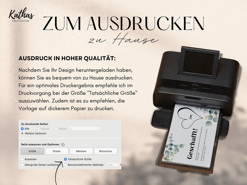 May include: A black printer with a white card being printed. The card has a green and white floral design with the text "Geschafft!" in a white heart. The printer screen shows a menu with options for printing, including "Tats&auml;chliche Gr&ouml;&szlig;e" which is selected.