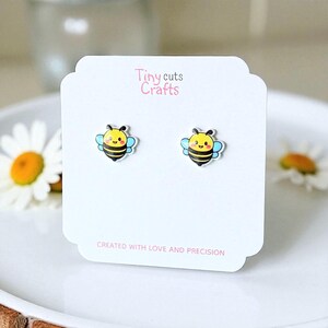 Cute bee studs with smiling design yellow face blue wings and pink cheeks, resin gloss acrylic earrings hypoallergenic posts insect gift for her