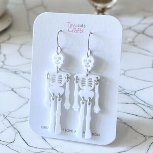 Skeleton earrings, Halloween jewelry, spooky novelty gift, goth accessories, 2.75-inch by 0.80-inch, stainless steel, fall fashion, gift for her, Halloween party gift.