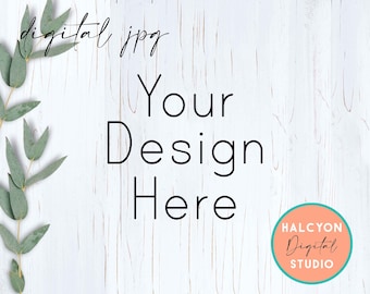 May include: White wood background with a eucalyptus branch on the left side. The text "Your Design Here" is in the center of the image. A teal circle with a peach background contains the text "HALCYON Digital STUDIO".