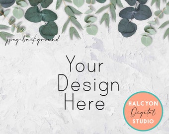 May include: A white textured background with a border of green eucalyptus leaves. The text "Your Design Here" is in the center of the image. A peach-colored circle with the text "HALCYON Digital STUDIO" is in the lower right corner.
