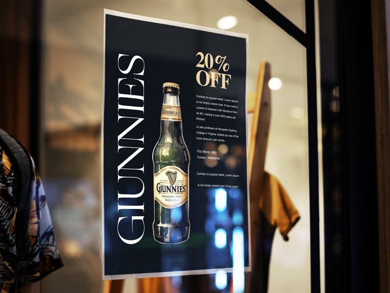Op de afbeelding: Een zwart-wit bord met de tekst "Guinness" in wit en "20% Korting" in goud. Op het bord staat een fles Guinness-bier afgebeeld.