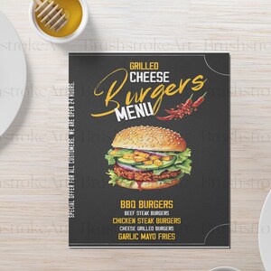 Op de afbeelding: Een zwart-wit menu voor een restaurant genaamd "Grilled Cheese Burgers". Het menu bevat een grote illustratie van een cheeseburger met sla, tomaat en augurk. Het menu bevat de volgende items: BBQ Burgers, Beef Steak Burgers, Chicken Steak Burgers, Cheese Grilled Burgers en Garlic Mayo Fries.