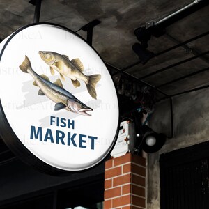 May include: A white round sign with a black border hangs above a brick wall. The sign has a graphic of two fish and the text "FISH MARKET" in blue letters.