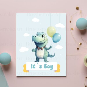 Op de afbeelding: Een blauwe baby-alligator die drie ballonnen vasthoudt, twee gele en een blauwe, met de tekst "It's a Boy" op een gele banner.