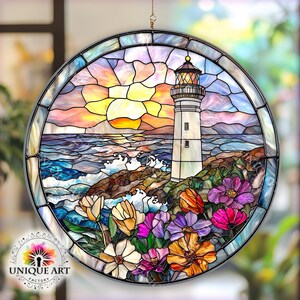 May include: A stained glass window depicting a lighthouse on a rocky shore with crashing waves and a sunset in the background. The scene is framed by a circle of colorful flowers.