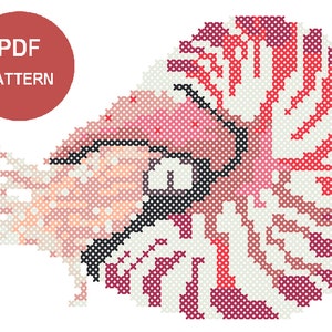 May include: Cross-stitch pattern of a nautilus shell in shades of pink, red, and white, with a black outline. The design is a PDF pattern, indicated by a red circle with white text.