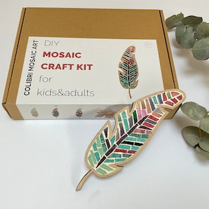 May include: DIY mosaic craft kit featuring a colorful feather design. The kit is for kids and adults and includes everything needed to create a beautiful mosaic art piece.
