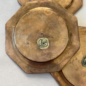 Enhance your decor with this stunning set of GALLO brass coasters from the 1960s. Their geometric design, rich patina, and substantial weight bring both mid-century style and timeless appeal to any table or display.