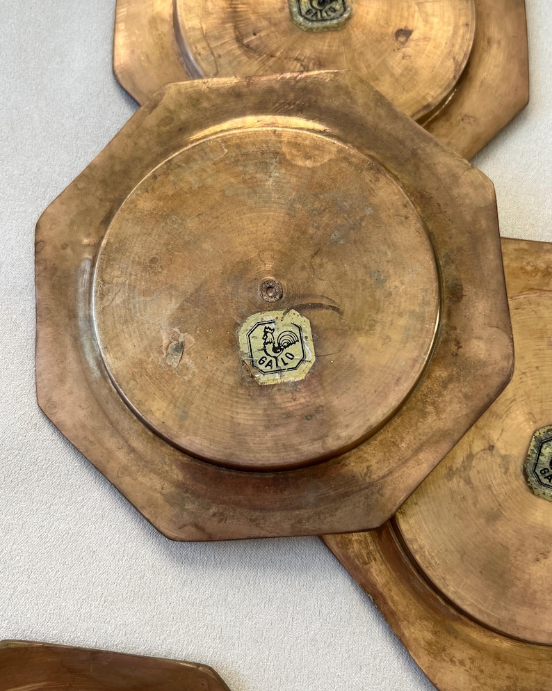 Enhance your decor with this stunning set of GALLO brass coasters from the 1960s. Their geometric design, rich patina, and substantial weight bring both mid-century style and timeless appeal to any table or display.