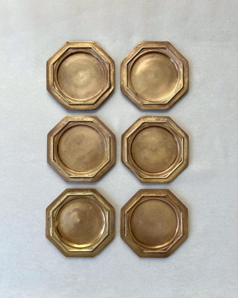 This rare set of 6 GALLO brass coasters, made in Italy in the 1960s, showcases a bold geometric design and rich patina. Perfect for mid-century enthusiasts, these sturdy coasters add vintage charm to any setting.