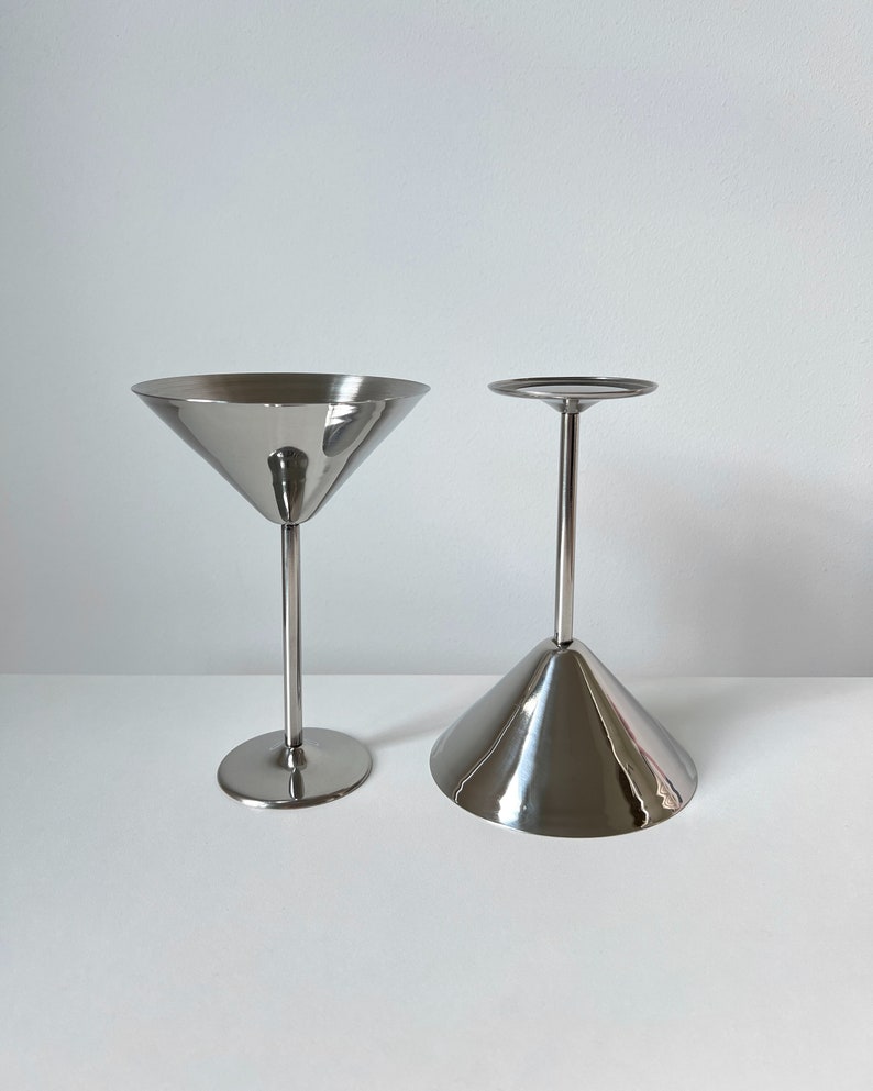 Add a touch of sophistication to your table with these Beckmann and Rommerskirchen stainless steel cocktail dessert ice cream cups. Crafted in 80s Germany, their tall silver stems and sleek design make them perfect for serving drinks or desserts.