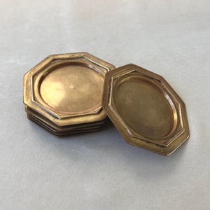 Crafted in the 1960s, this set of 6 GALLO brass coasters embodies Italian craftsmanship and vintage appeal. With a rich patina and bold geometric shape, they are a perfect addition to any mid-century decor.