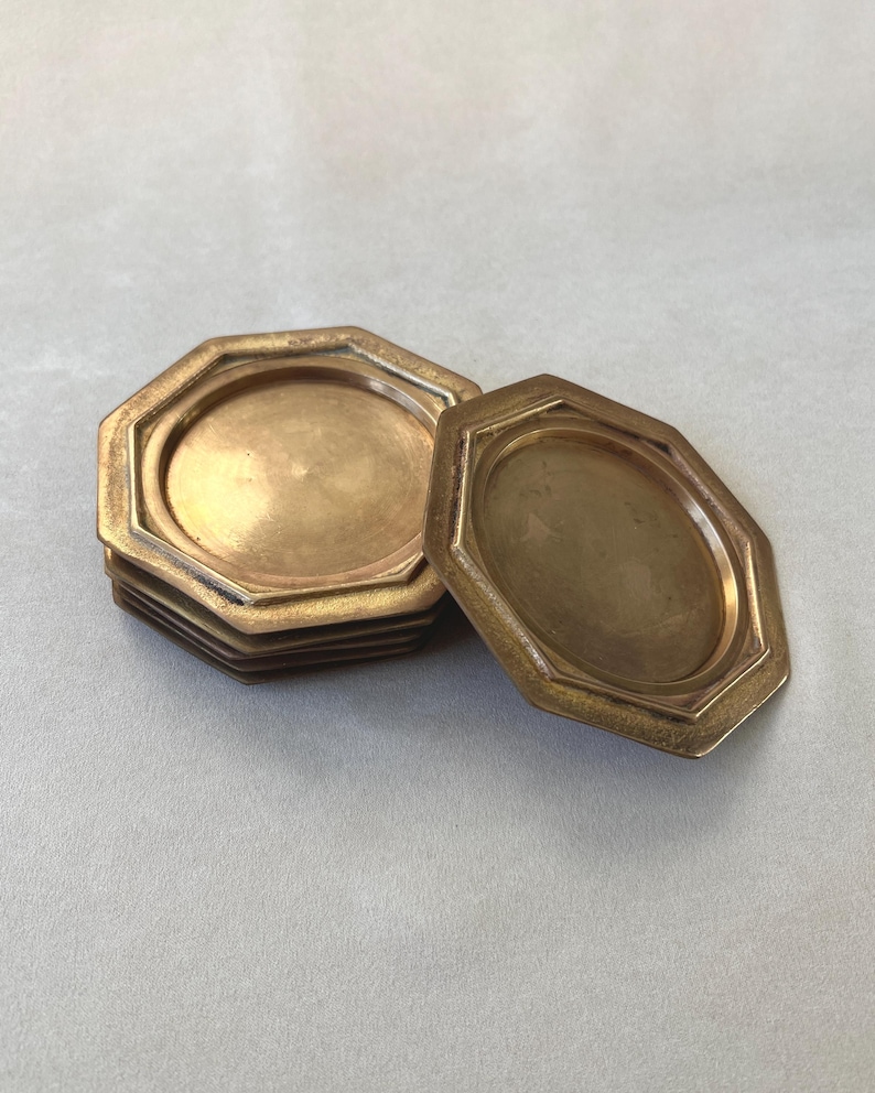 Crafted in the 1960s, this set of 6 GALLO brass coasters embodies Italian craftsmanship and vintage appeal. With a rich patina and bold geometric shape, they are a perfect addition to any mid-century decor.