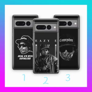 May include: Three black phone cases with different designs. The first case features a black and white illustration of a rapper with the text "Real G's Stay Ruthless". The second case features a black and white illustration of a rapper with the text "Eazy-E". The third case features a black and white illustration of a skull with the text "Compton".