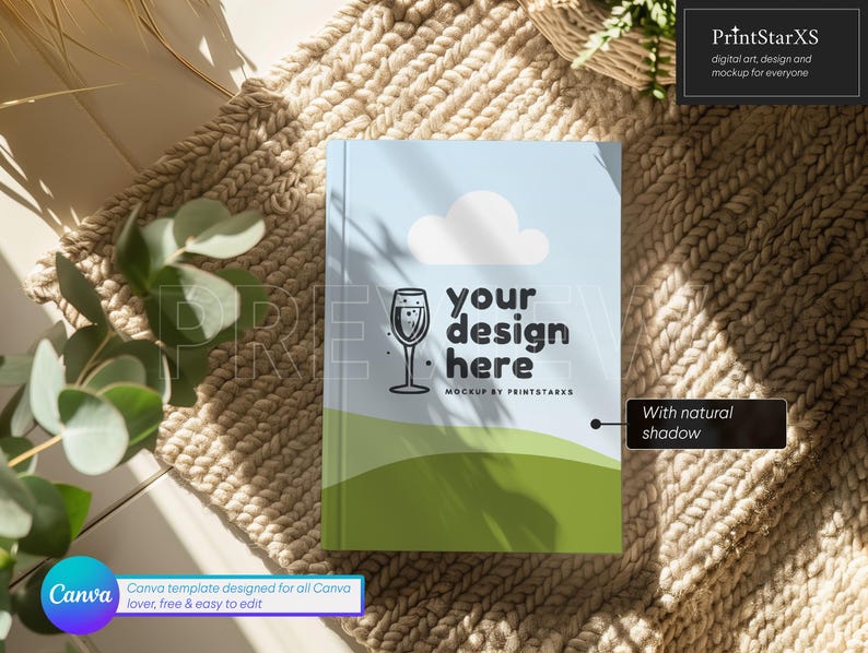 K&ouml;nnte beinhalten: Ein Mockup eines Buchcovers mit hellblauem Hintergrund und einer gr&uuml;nen und wei&szlig;en Landschaft. Der Text "your design here" ist in Schwarz auf dem Cover geschrieben. Das Buch liegt auf einem beigefarbenen gewebten Teppich mit einem nat&uuml;rlichen Schatten.