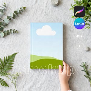 May include: A mockup notebook with a sky and cloud design on the cover. The notebook is held by a person's hand. The word "mockup" is overlaid on the image. Green foliage and design app icons are in the background.