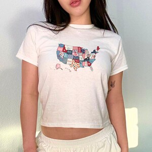 4th of July Baby Tee American Flag Baby Tee Coquette Baby Tee July 4th Crop Top Americacore Y2K Baby Tee Patriotic Baby Tee Merica Shirt