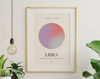 May include: A framed print with a light pink background featuring a gradient circle in shades of purple, pink, and gray. The text "SEPTEMBER 23 - OCTOBER 22" is at the top, followed by the word "LIBRA" in a bold, black font. Below the word "LIBRA" is the text "CHARMING, DIPLOMATIC, SOCIAL, BALANCED" and a Libra zodiac symbol.