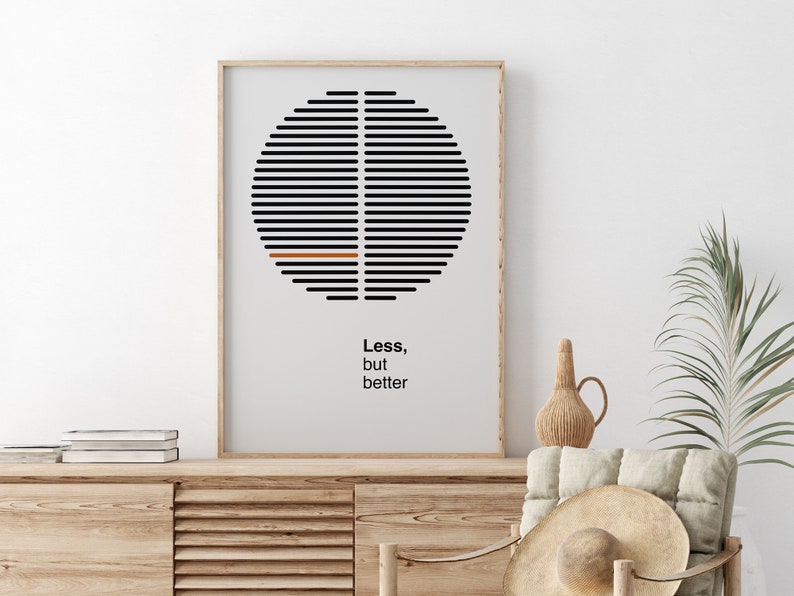 Op de afbeelding: Een ingelijst zwart-wit minimalistisch poster met een cirkelvormig ontwerp en de tekst "Minder, maar beter".