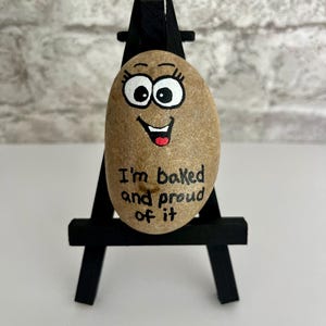 May include: A set of three ceramic mugs with a speckled, matte finish. The mugs are in shades of cream, light gray, and dark gray. Each mug has a simple, minimalist design, perfect for coffee or tea.