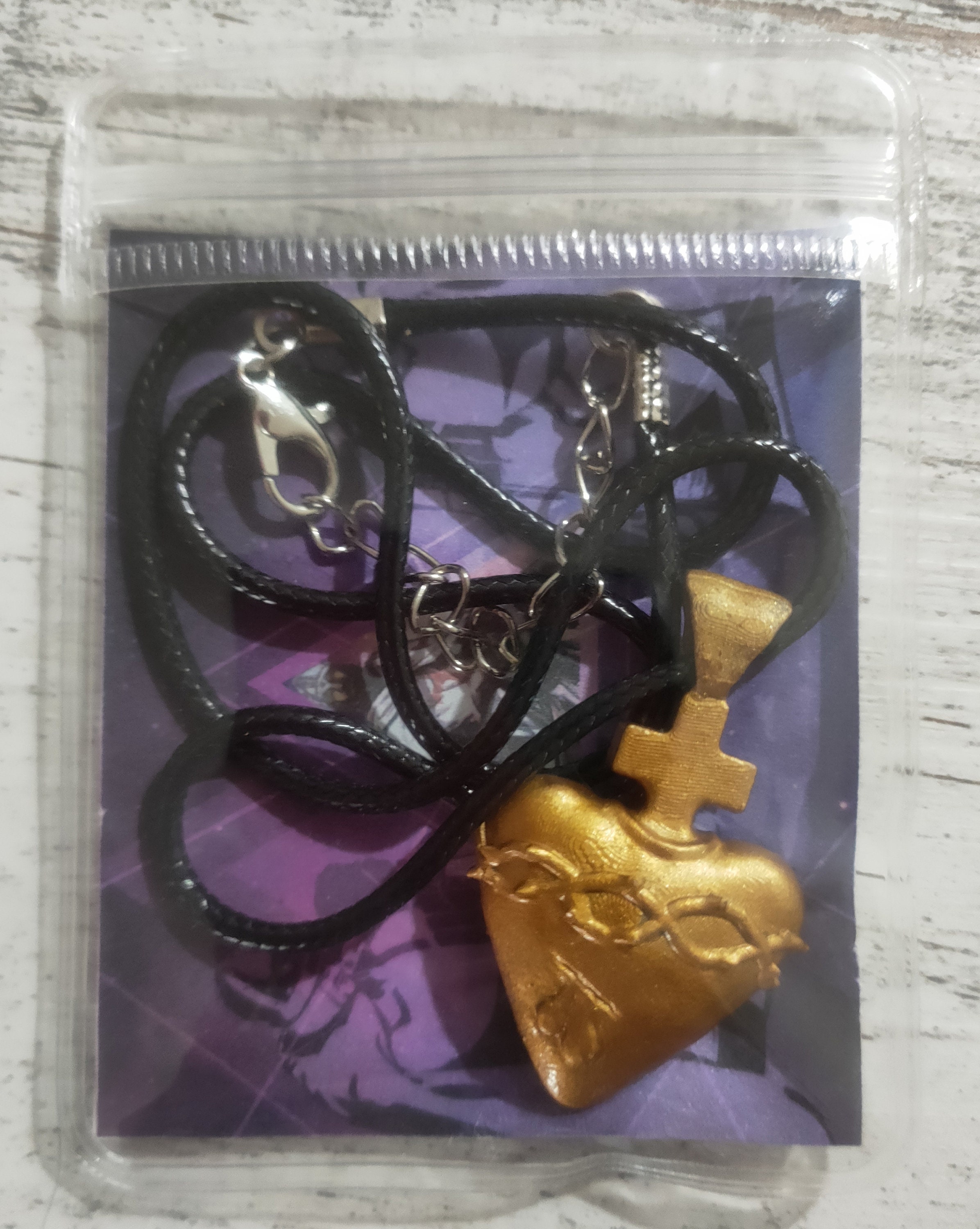 Ciondolo Sacro cuore di Gesù con greca oro 18K