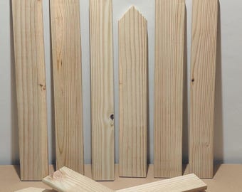May include: Wooden fence pickets and arrow-shaped pieces arranged on a neutral surface. The text "1 Arrow" is displayed at the top. The pickets are various lengths and have a natural wood grain.