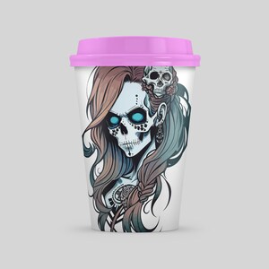 May include: A white travel mug with a pink lid features a colorful illustration of a woman with a skull face and long hair. The skull has blue eyes and is adorned with floral details.
