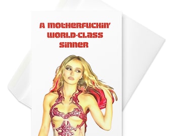 May include: A white greeting card featuring a stylized illustration of a blonde individual with long wavy hair, wearing a red cutout top. The text A MOTHERFUCKIN' WORLD-CLASS SINNER is printed in bold red capital letters at the top of the card.