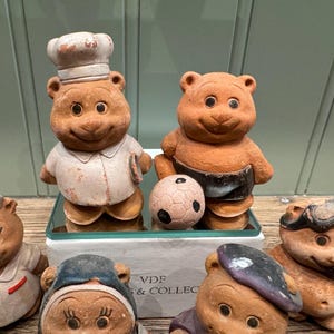 Set of 21 vintage terracotta collectible bear figurines with different professions and activities