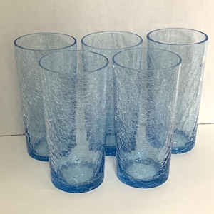 May include: Set of six blue crackle glass tumblers. The glasses are clear with a textured, crackled surface.