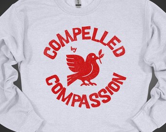 Felpa "Costretto dalla compassione", grafica della colomba della pace, regalo per attivisti