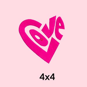 May include: Pink embroidered design of the word "LOVE" in a heart shape.