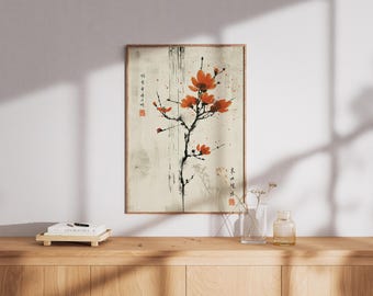 May include: A framed art print with a Japanese floral design. The artwork depicts a black branch with bright orange blossoms against a cream background. The print includes Japanese characters and is displayed on a wooden surface.