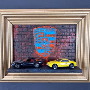 Porsche Parking Hot Wheels graffiti display. Framed custom artwork to display your diecast Porsche. Great for the car lover in your life.