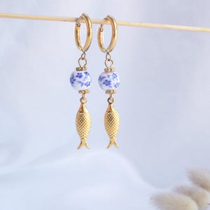 front view of Gold Sardine Earrings with Ceramic Tile from Portugal on display - Coastal Jewelry from Portugal, seabylou, Sea by Lou, Fish earrings