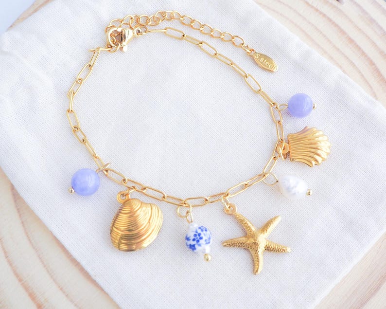 Charm Bracelet with Gold Starfish, Shell pendants, Azulejo Tile ceramic beads, gemstones. Ocean inspired jewelry from Portugal
