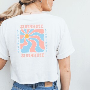 Opstrijkpatch met zonnetje en bloemmotief in retro blauw en roze, opstrijkbaar motief voor doe-het-zelf kleding