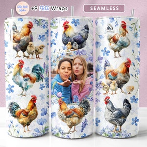 May include: A white tumbler with a seamless design featuring watercolour illustrations of chickens and chicks on a white background with blue flowers. The tumbler has a straw and a lid. The text "SEAMLESS" is printed on the tumbler.
