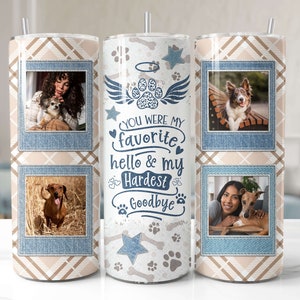 May include: A white tumbler with a blue denim pattern and paw prints. The tumbler has three photo slots with images of dogs and their owners. The text on the tumbler reads "You were my favorite hello & my hardest goodbye".